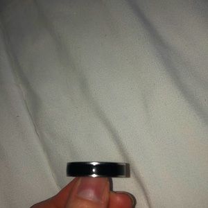 Men’s black and stainless steels ring.